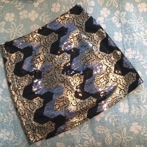 Head turning gold and black sequin mini skirt.